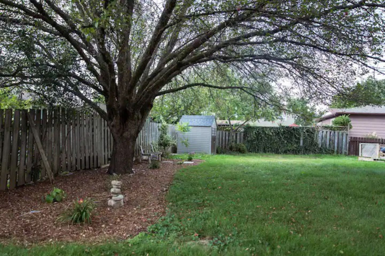 The backyard porch is filled with natural light, creating a bright and welcoming space that invites relaxation.
