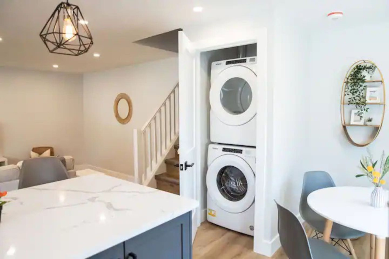 Laundry room with a washer, dryer, and folding area, offering all the convenience you need for a comfortable extended stay.