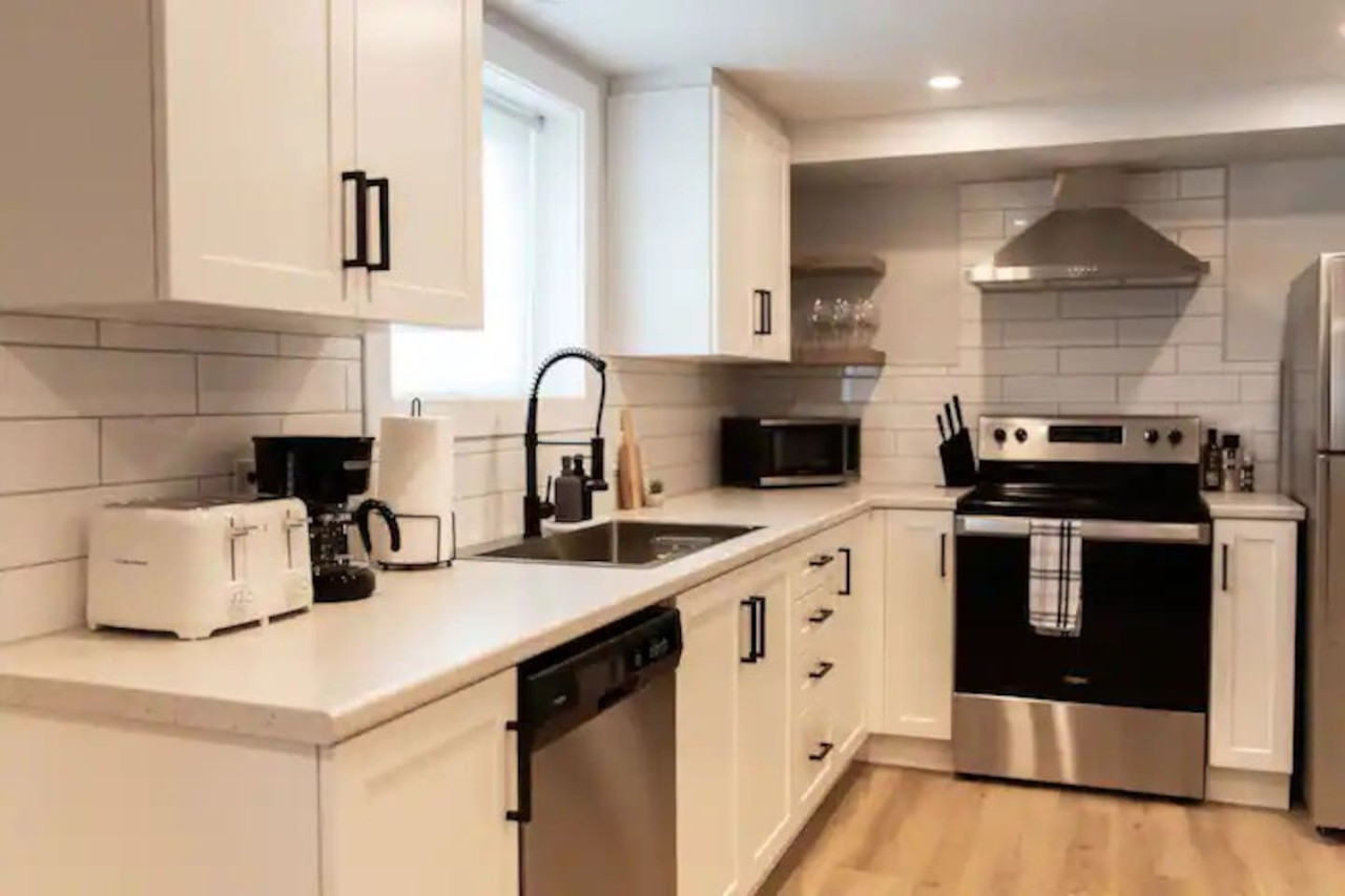 The kitchen invites you to experiment with new recipes, offering a stylish and practical space to cook and create.