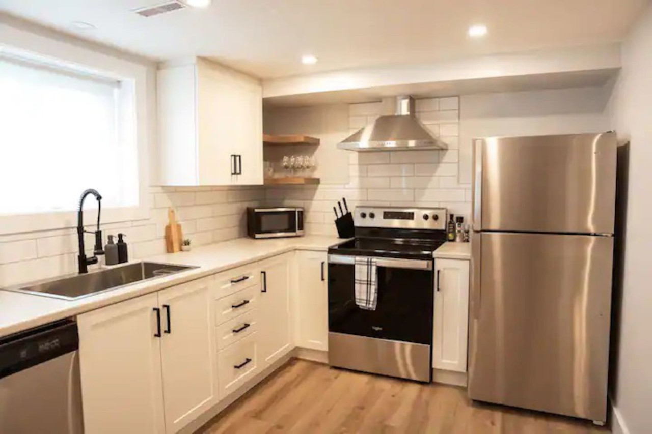 The kitchen invites you to experiment with new recipes, offering a stylish and practical space to cook and create.