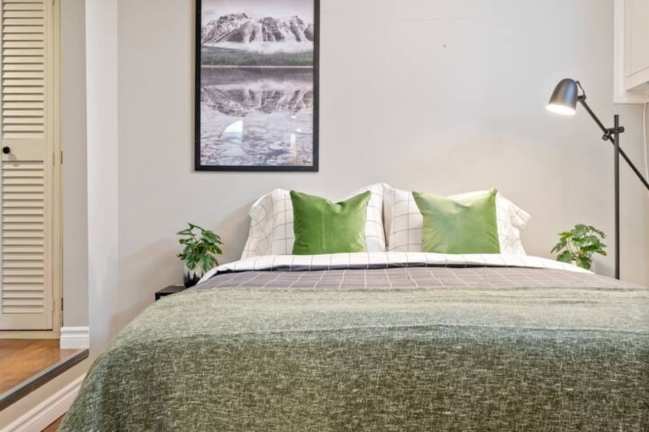 The bedroom’s serene ambiance invites you to relax, with a plush bed that promises a restful night's sleep.