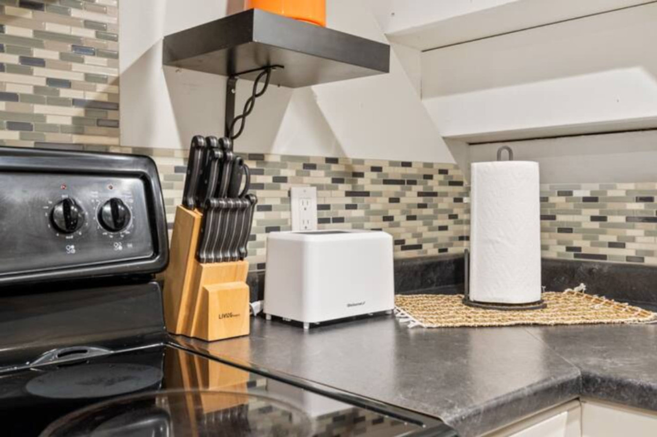 Fully equipped kitchen with all the tools you need for a perfect culinary experience. Enjoy the convenience of having everything at your fingertips!