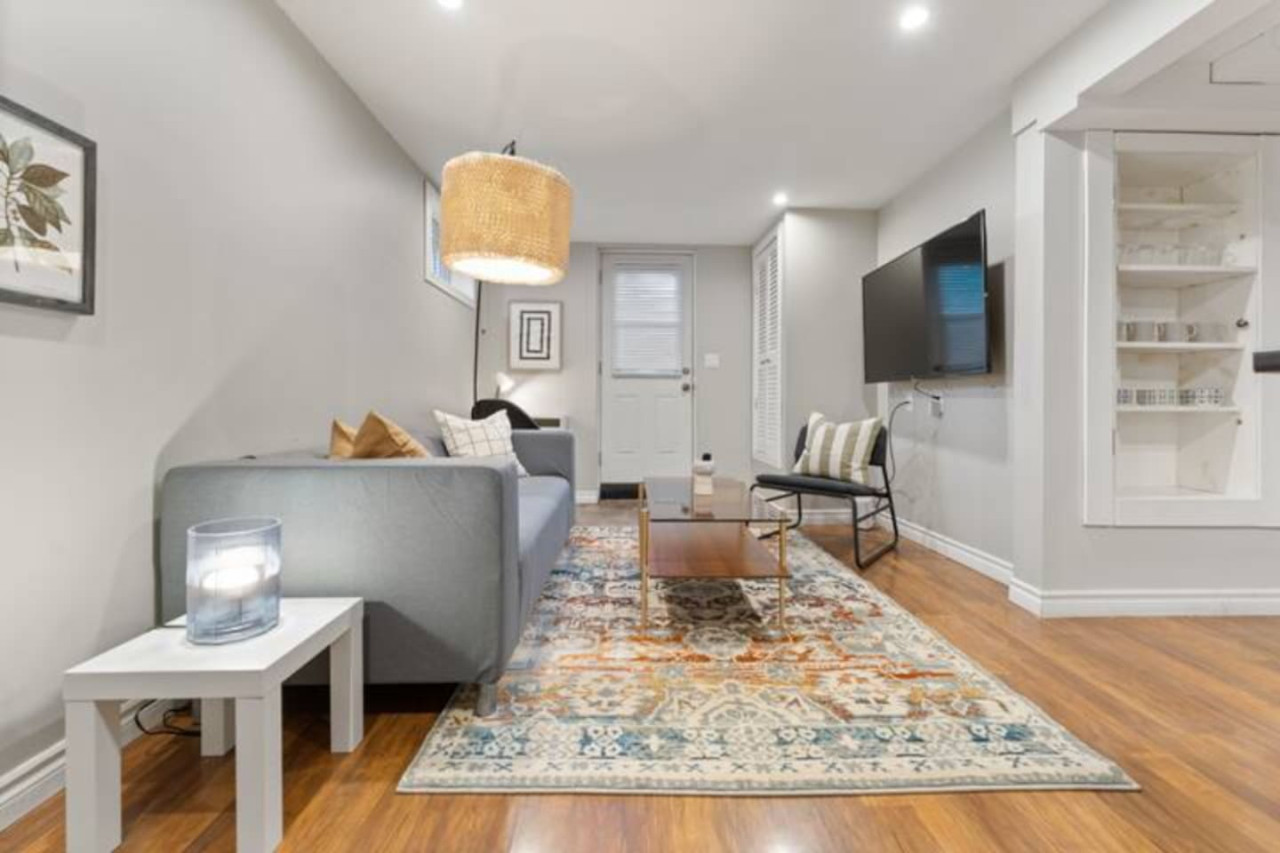 Relax in this warm, inviting space with wooden accents and cozy furnishings. You’ll love unwinding on the plush sofa, enjoying a good book or streaming your favorite shows in a serene atmosphere
