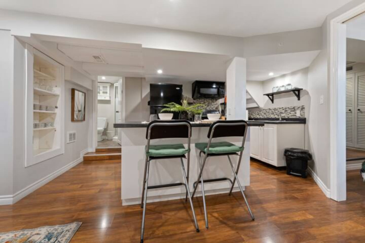 The dining room is bathed in natural light, creating a bright and inviting space where every meal feels special.