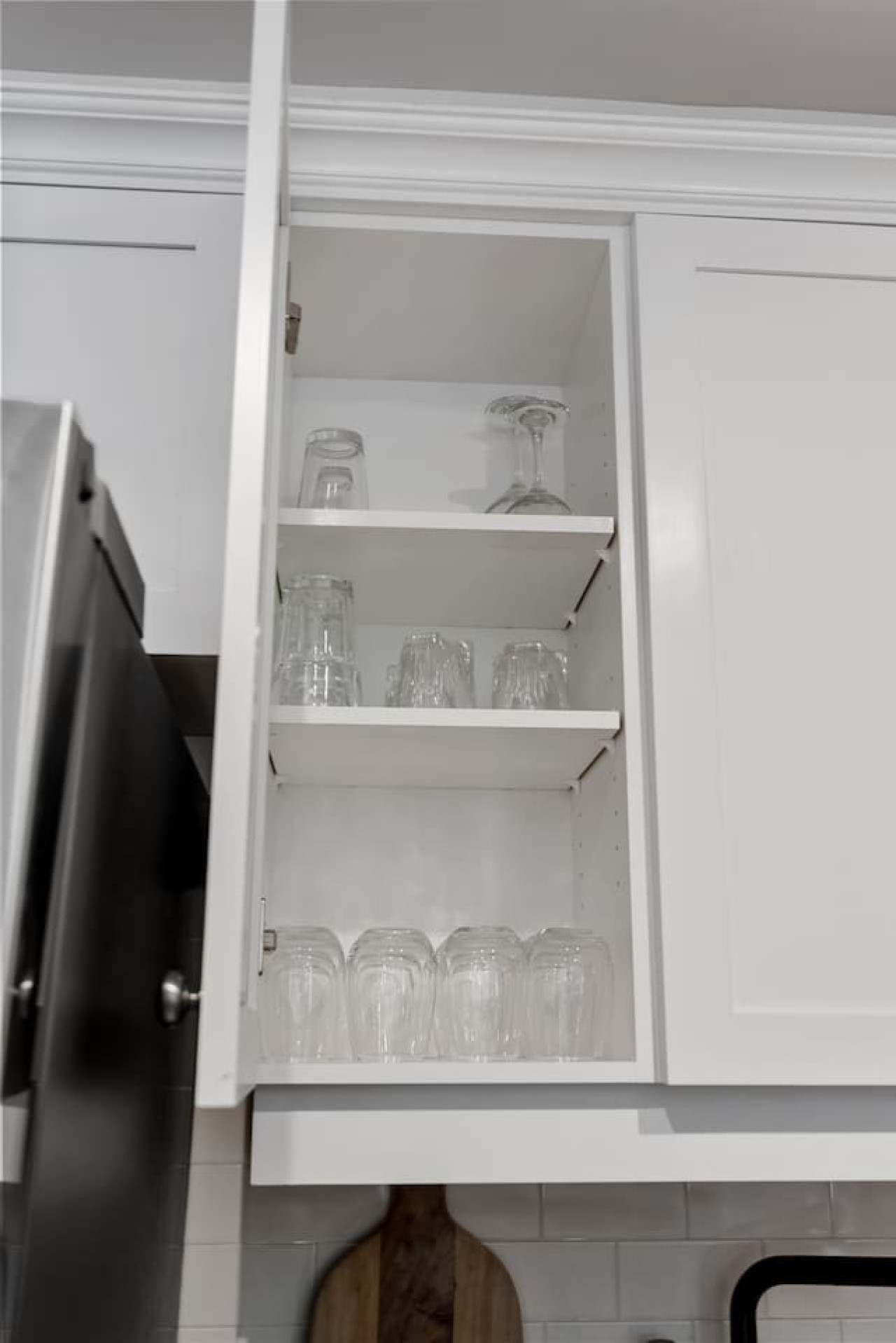 Kitchen cabinets stocked with cooking wares, glassware and silverwares, ideal for mixing up your favorite meals and drinks during your stay.