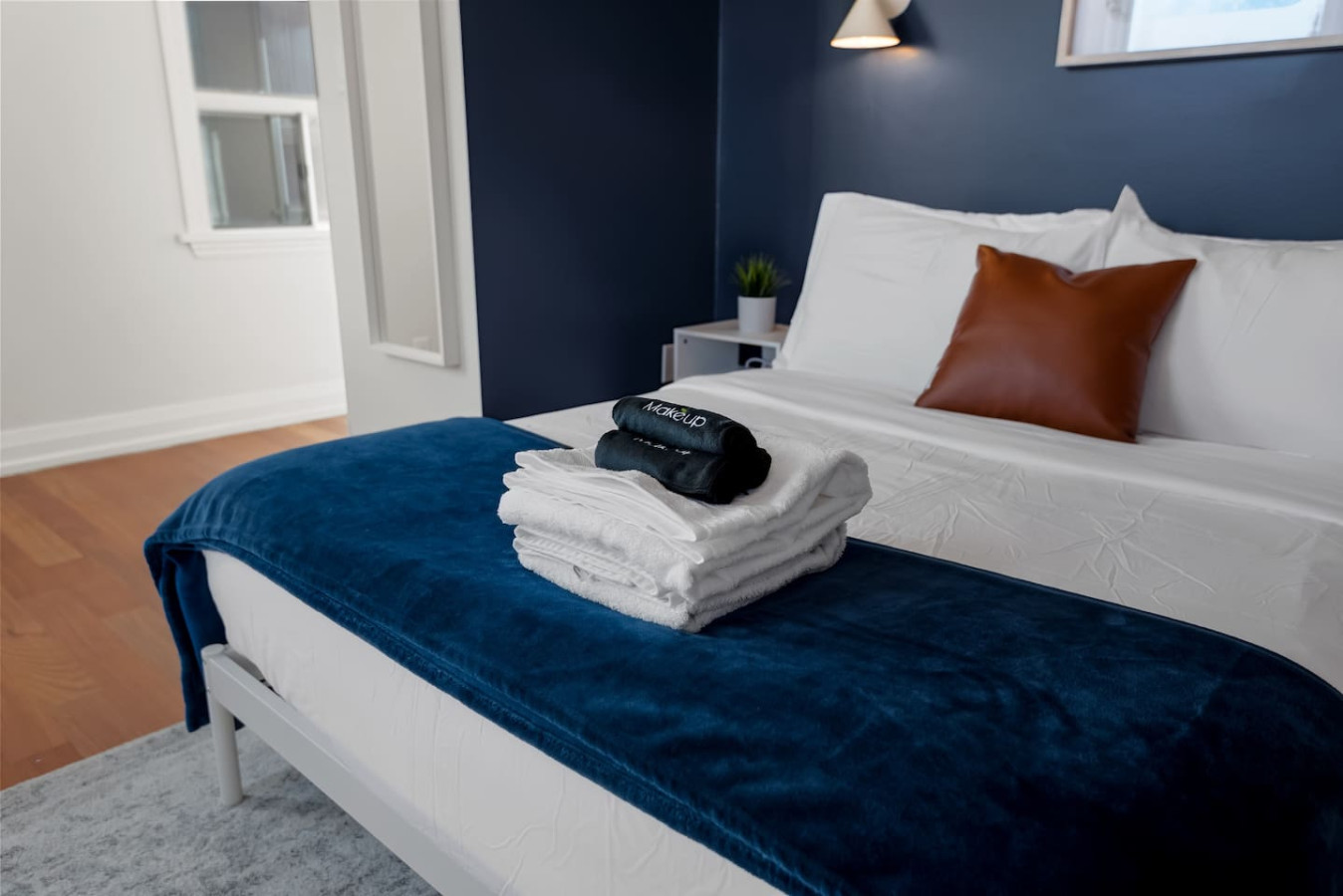 The bedroom offers a luxurious retreat, with a bed that promises restful nights and a room that feels like a private oasis.