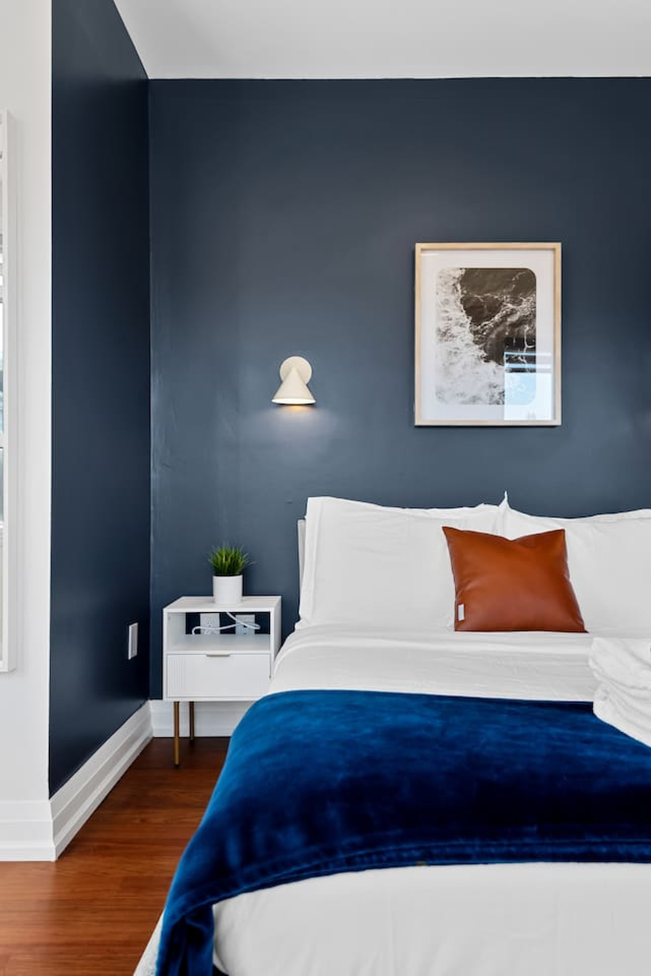The bedroom offers a luxurious retreat, with a bed that promises restful nights and a room that feels like a private oasis.