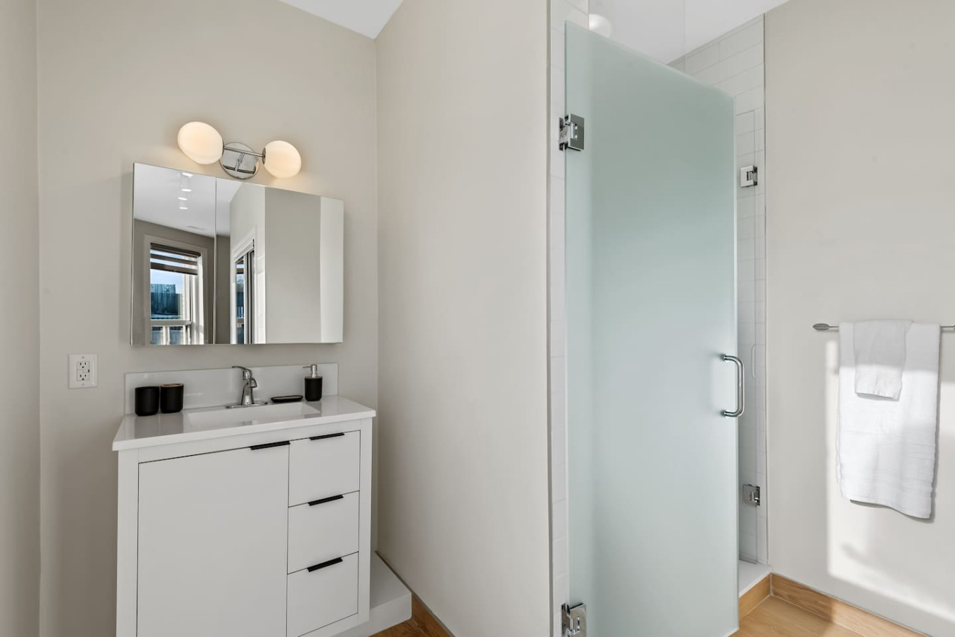 You feel a sense of calm as you enter the bathroom, where the thoughtful design and high-quality materials create a serene environment.