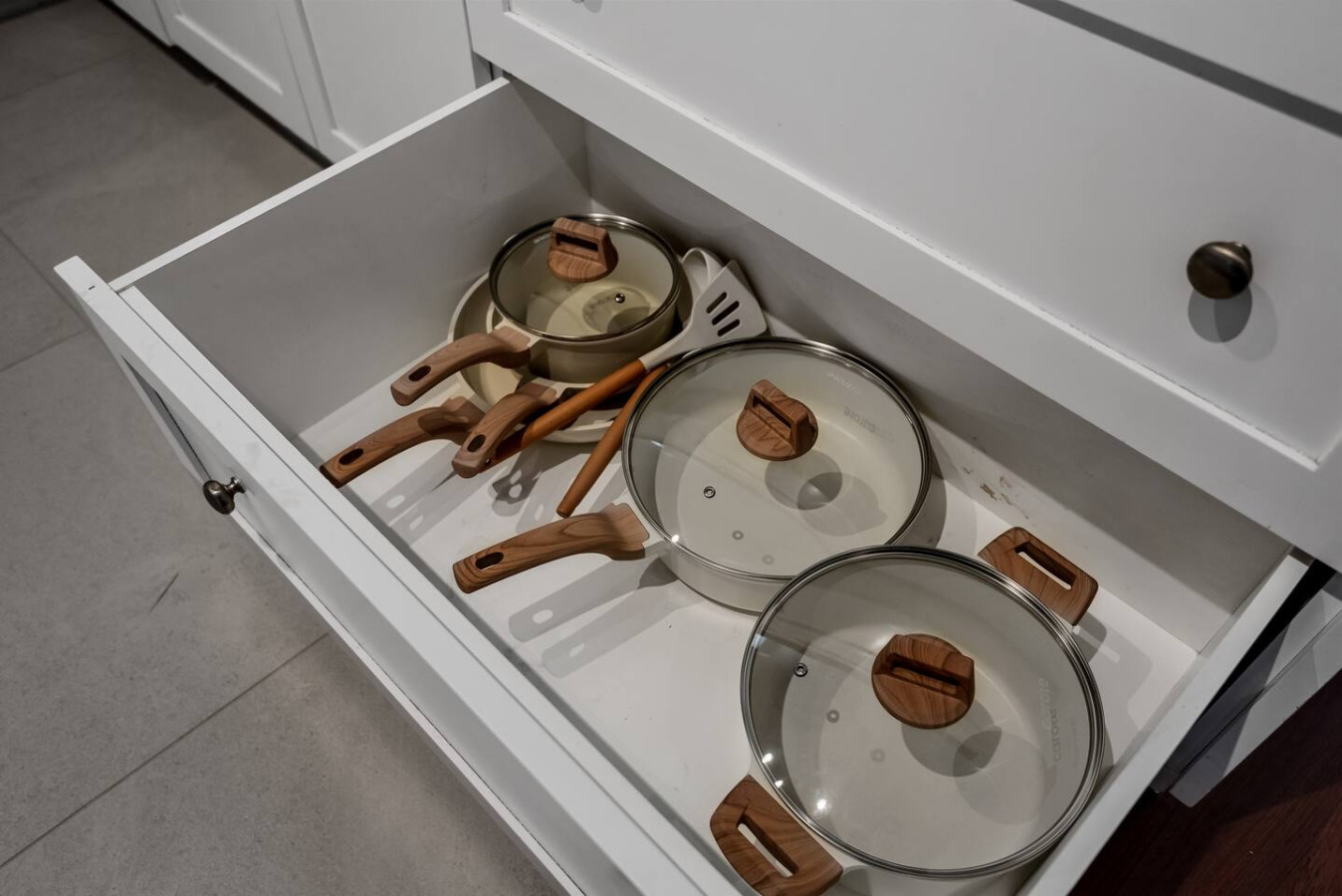 Cook with ease in this well-equipped kitchen featuring stainless steel appliances, ample cabinetry, and a stylish backsplash. Whether you're brewing coffee or preparing a gourmet meal, this space is designed for functionality and style, making every meal