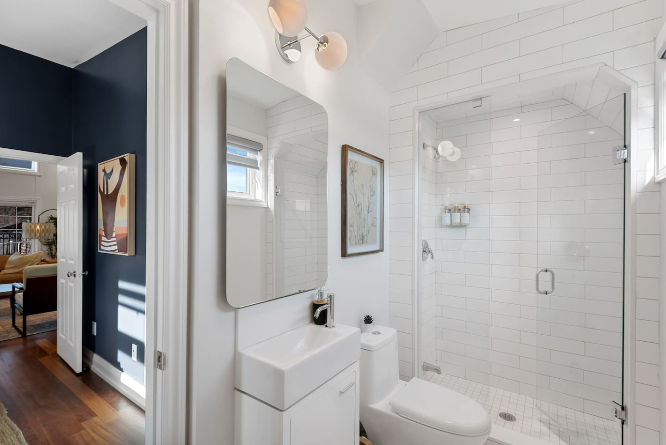 You feel a sense of calm as you enter the bathroom, where the thoughtful design and high-quality materials create a serene environment.