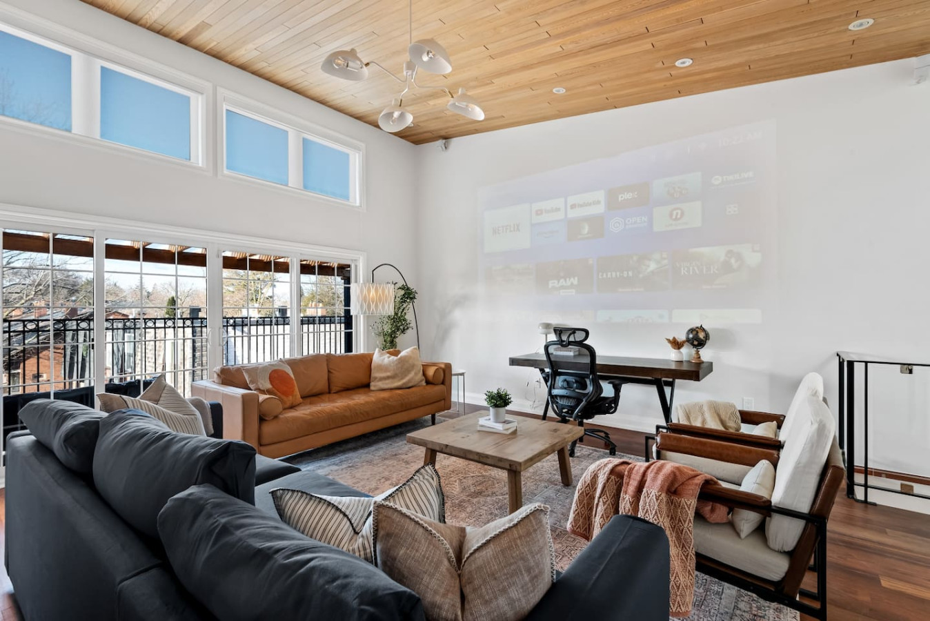 The living room’s cozy vibe makes it the perfect spot to relax, with ample seating and a warm ambiance.