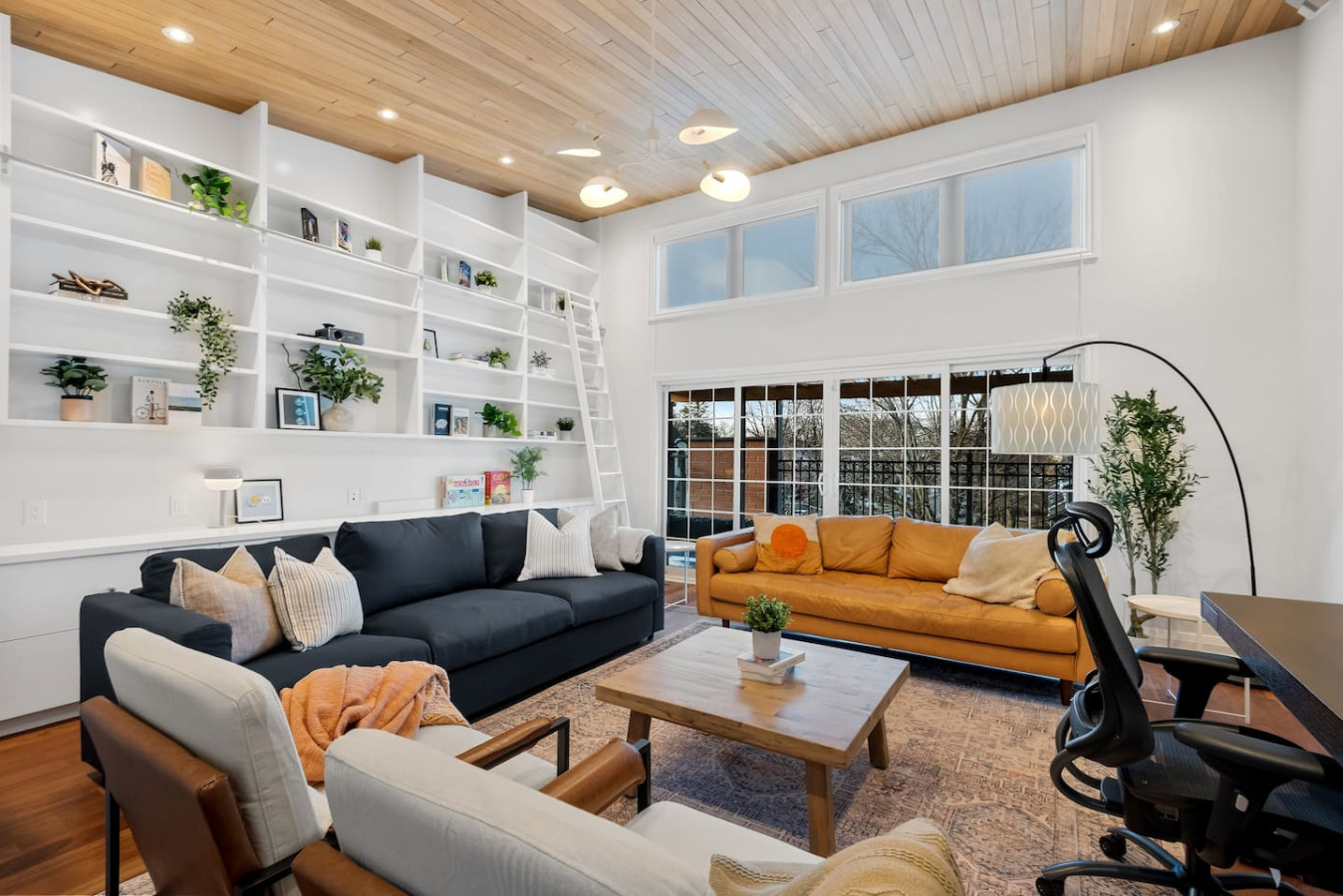 The living room is filled with natural light, creating a bright and welcoming space that invites relaxation.