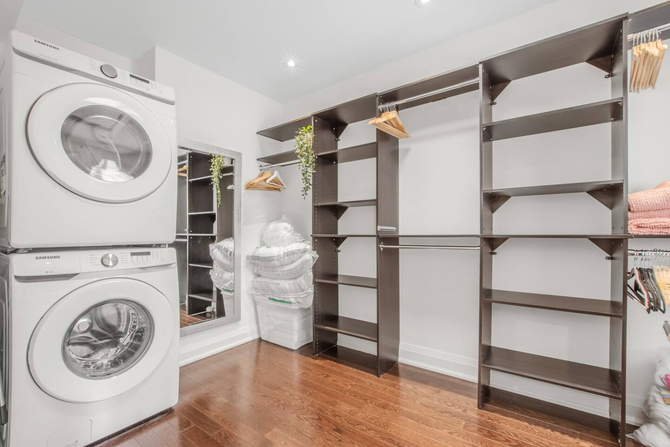 Walk-in closet with washer/dryer in master bedroom