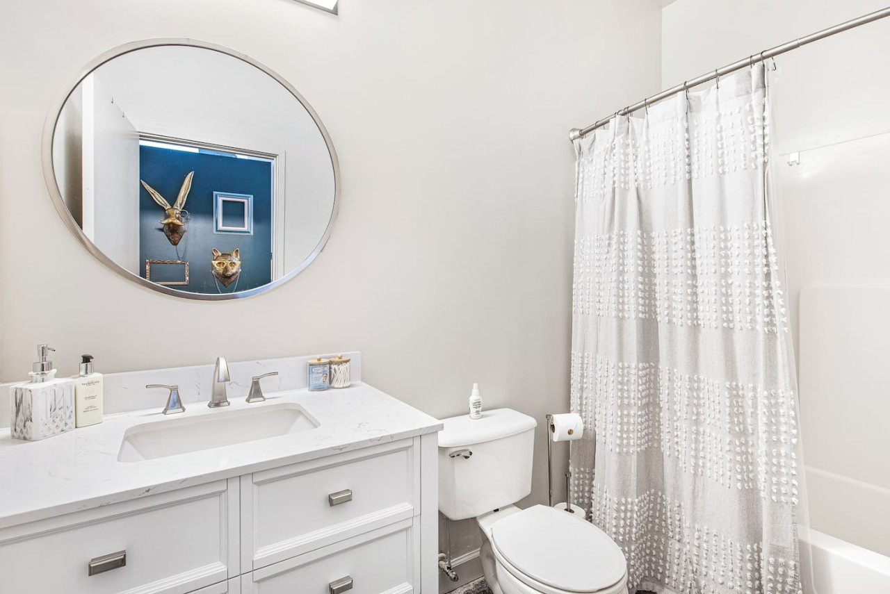 Updated bathroom with extra amenities for guests to enjoy.