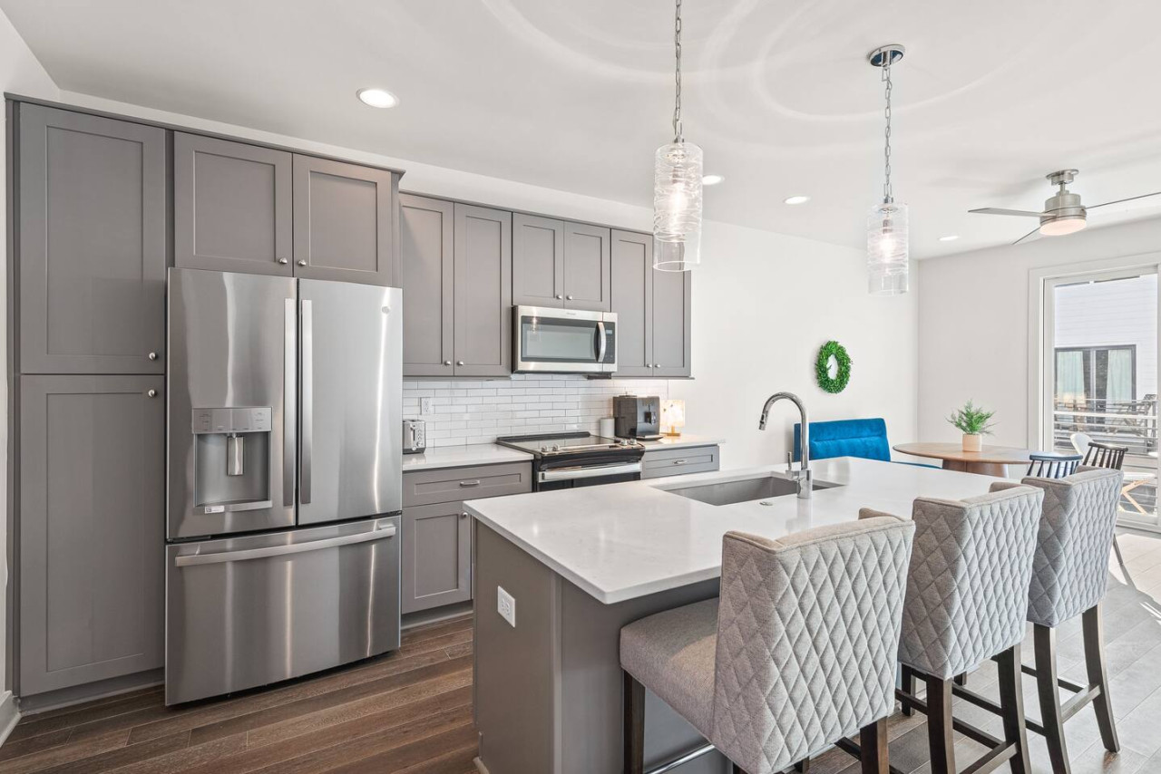 Modern & spacious kitchen with bar seating for 3 guests.