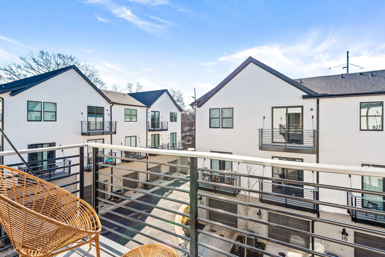 Second private balcony with seating in the primary bedroom.