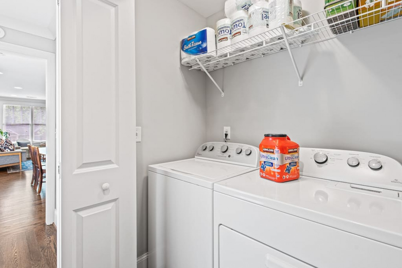 Laundry room with full-sized washer and dryer.