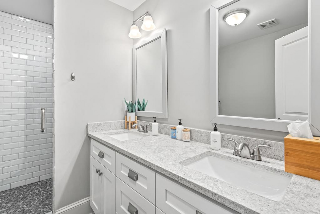 Primary bathroom with double sinks and Public Goods hair/body products.