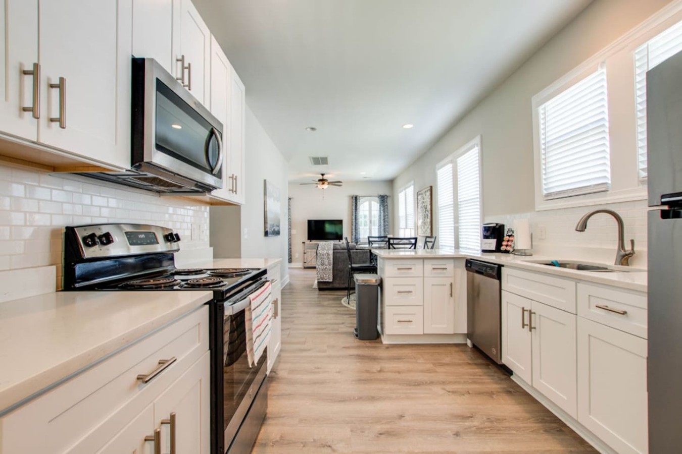 Modern, Fully Equipped Kitchen
Whip up meals with ease in this stylish kitchen featuring stainless steel appliances, ample counter space, and all the essentials for dining in.