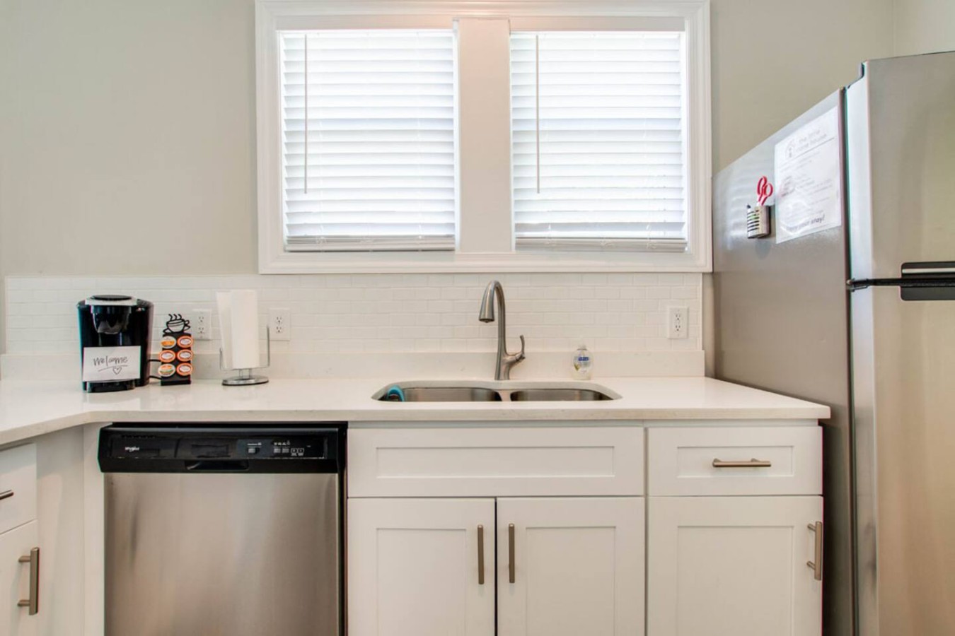 Coffee & Clean-Up Made Easy
Start your day with a fresh brew from the Keurig and enjoy the convenience of a dishwasher and full-size fridge — all in a bright, modern kitchen setup.
