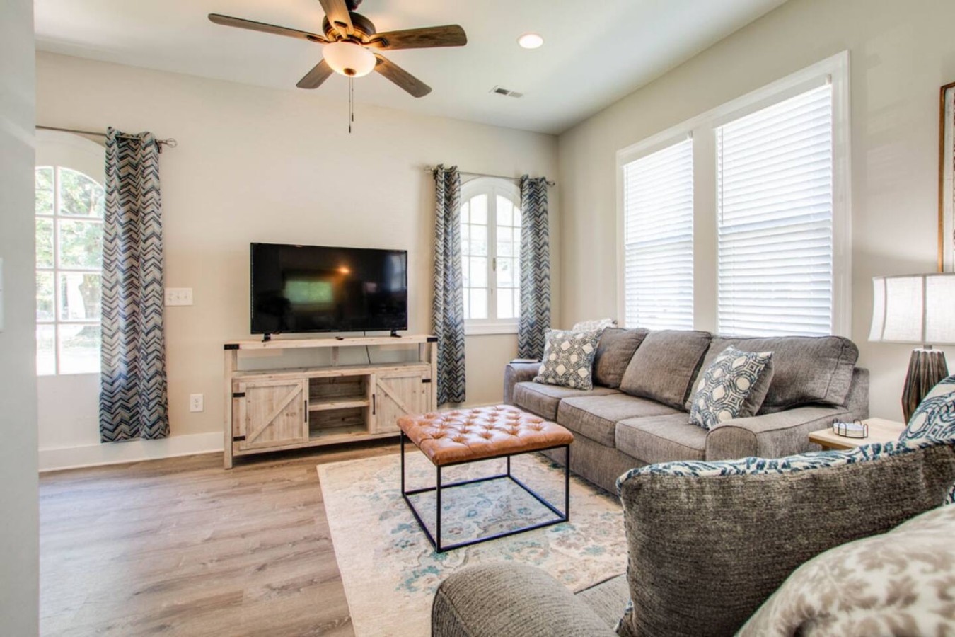 Bright & Inviting Entertainment Space
Enjoy your favorite shows on the large Smart TV or kick back with a book in this naturally lit living area. Soft seating, chic accents, and plenty of room to relax make it perfect for families or small groups.