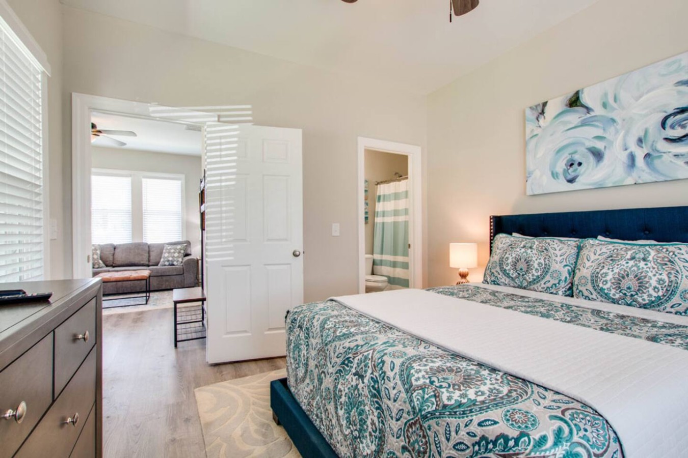 Spacious King Suite with Ensuite Bath
Relax in a plush king bed with fresh linens, a private bathroom, and direct access to the living area — perfect for unwinding after a day out.