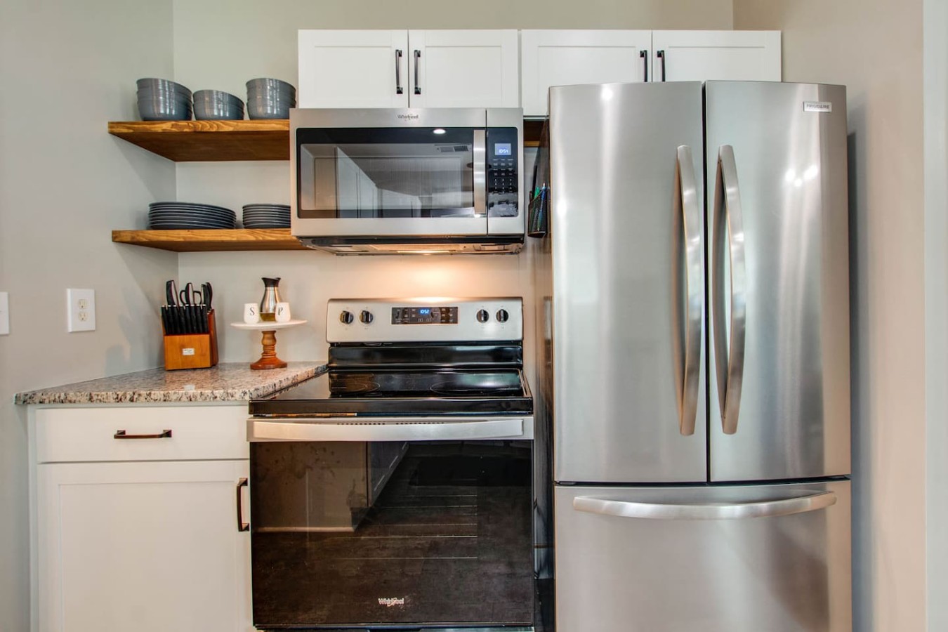 Fully functional kitchen with large capacity refrigerator.