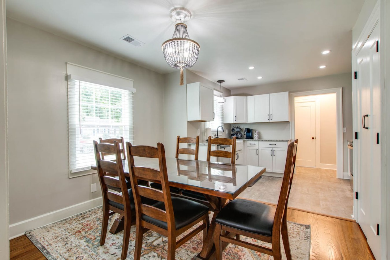 Stylish dining area with modern decor, perfect for intimate meals. Cozy ambiance and ample natural light create an inviting atmosphere.