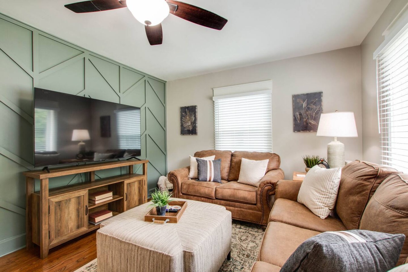 The living room has a beautiful accent wall. It also has a sleeper sofa if your party needs some extra sleep capacity. We have a 65" TV for your viewing pleasure.