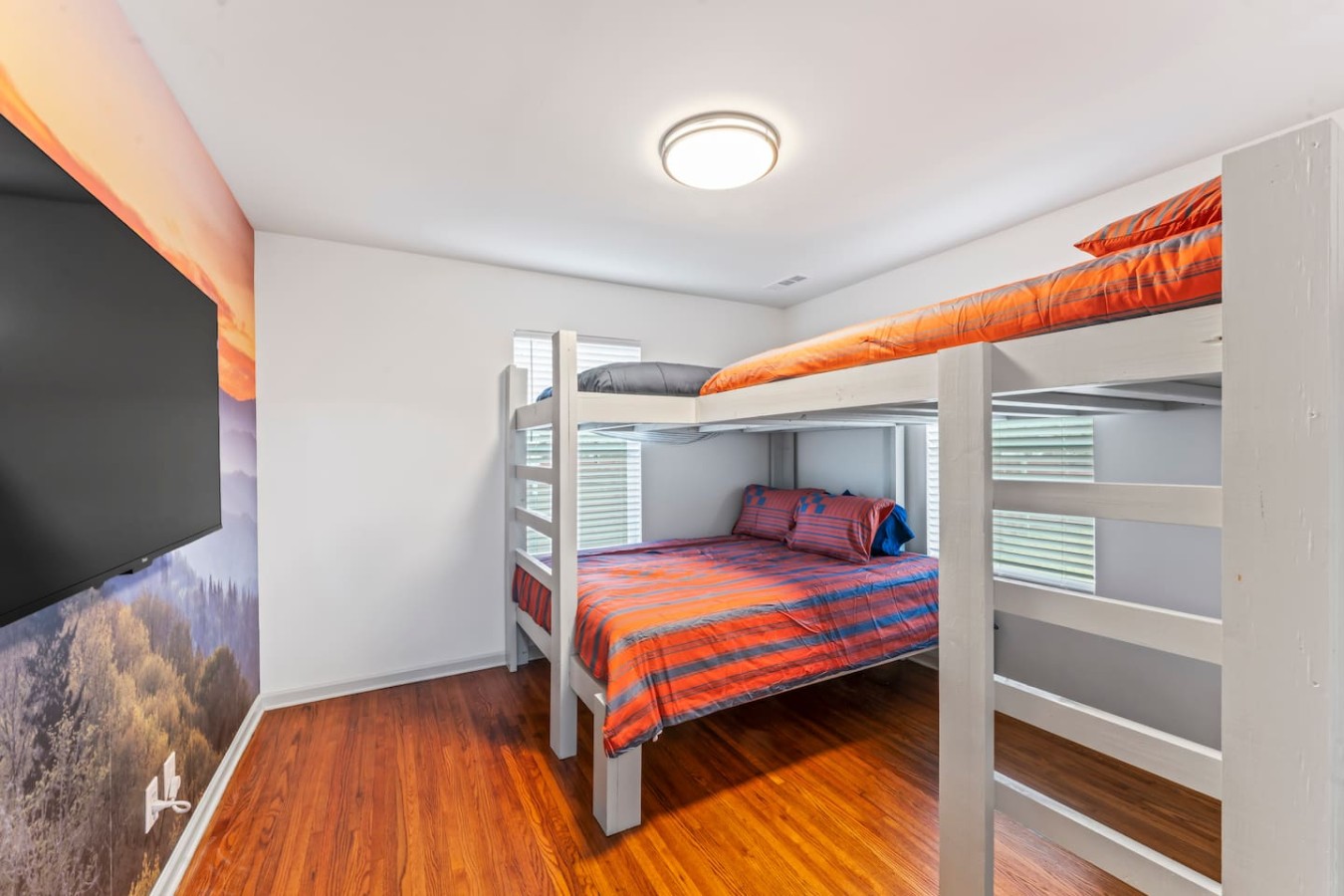 Explore our one-of-a-kind bunk bed—queen below, twin, and full above, plus a sizable TV. It is an ideal retreat for kids at TN Legends Retreat.