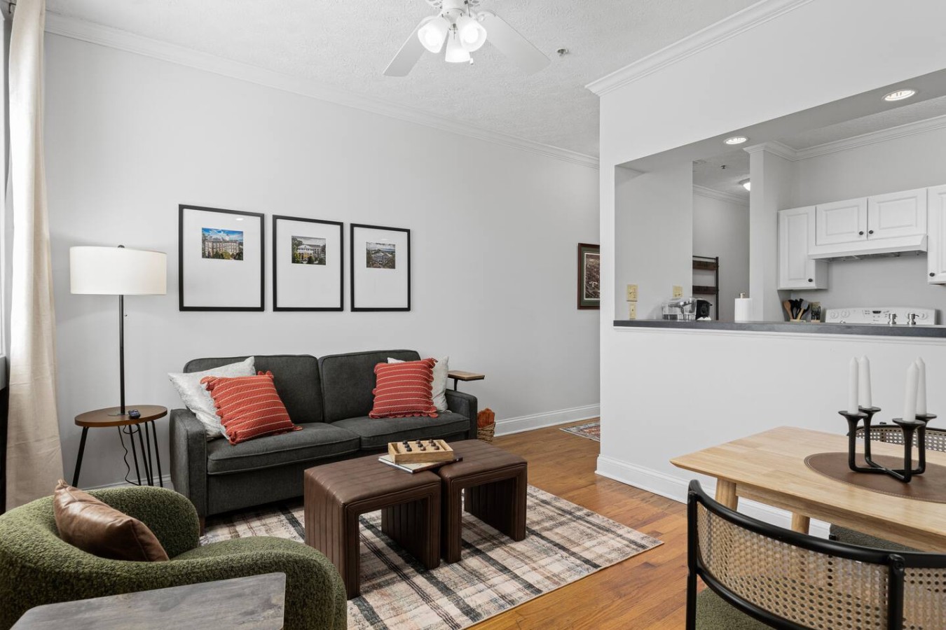 Relax in the spacious living area featuring a comfy sofa and stylish decor. The open layout flows effortlessly into the kitchen and dining nook, perfect for unwinding after exploring downtown Maryville. Enjoy the warm, welcoming vibe of this cozy ret