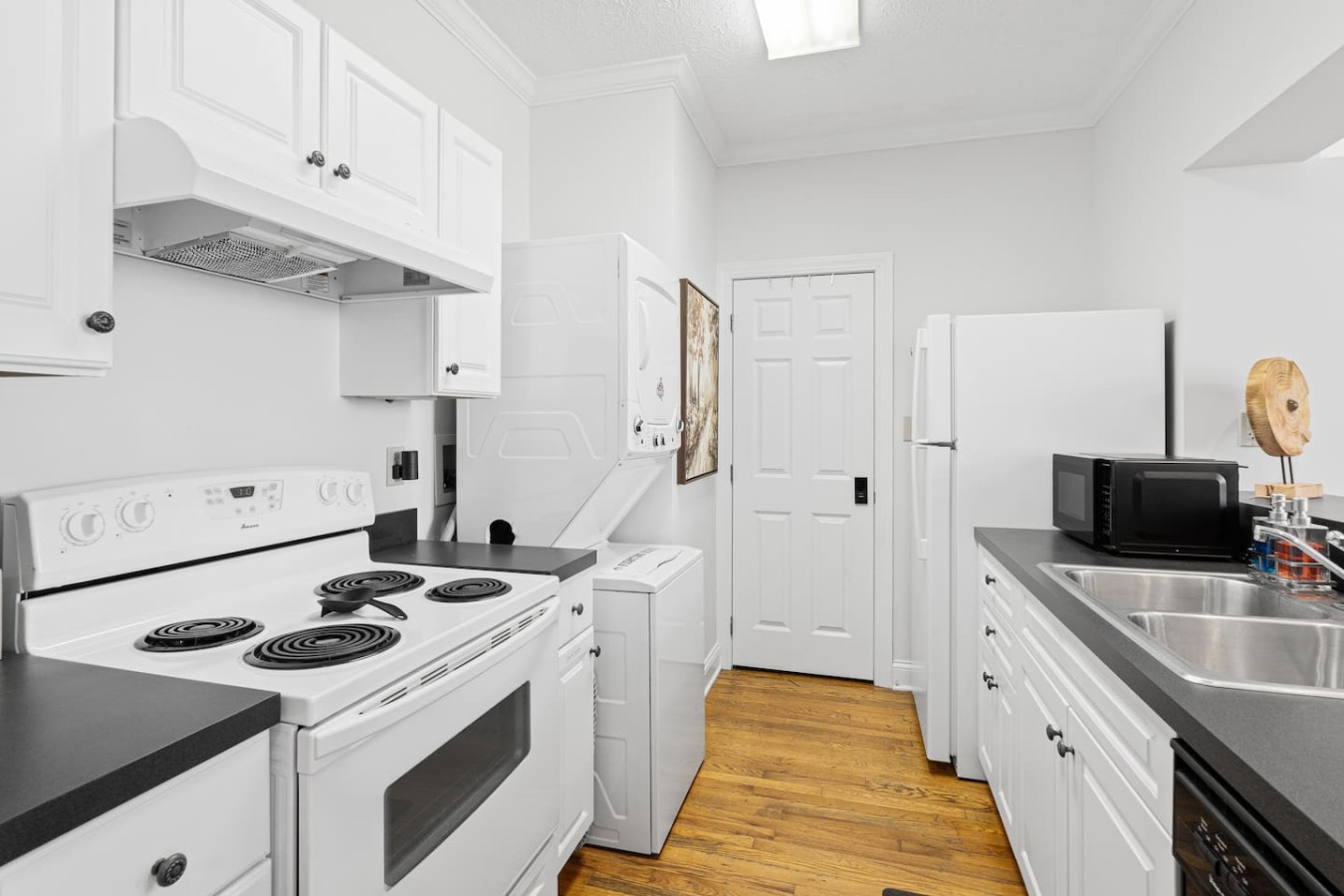 This fully stocked kitchen offers everything you need for a comfortable stay, including a full-size stove, refrigerator, microwave, and dishwasher. With plenty of counter space and modern appliances, cooking and dining in is both easy and convenient.