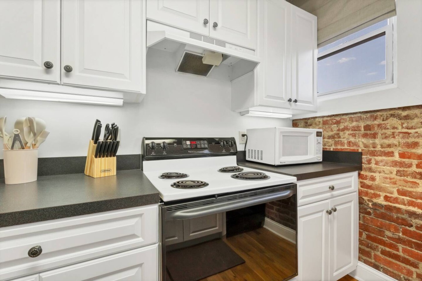 This cozy kitchen offers convenience and character, perfect for whipping up a quick meal or enjoying your morning coffee.