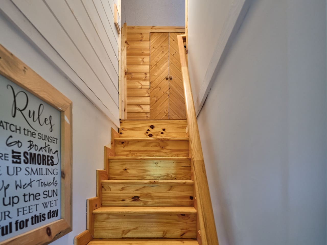 Stairs off the kitchen to the additional sleeping area with the twin XL beds.