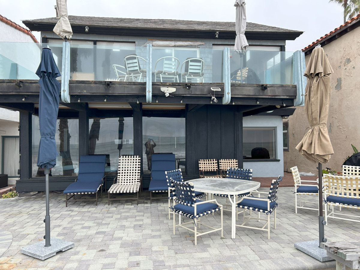 Front house view of upstairs deck. (Boulders out of view)