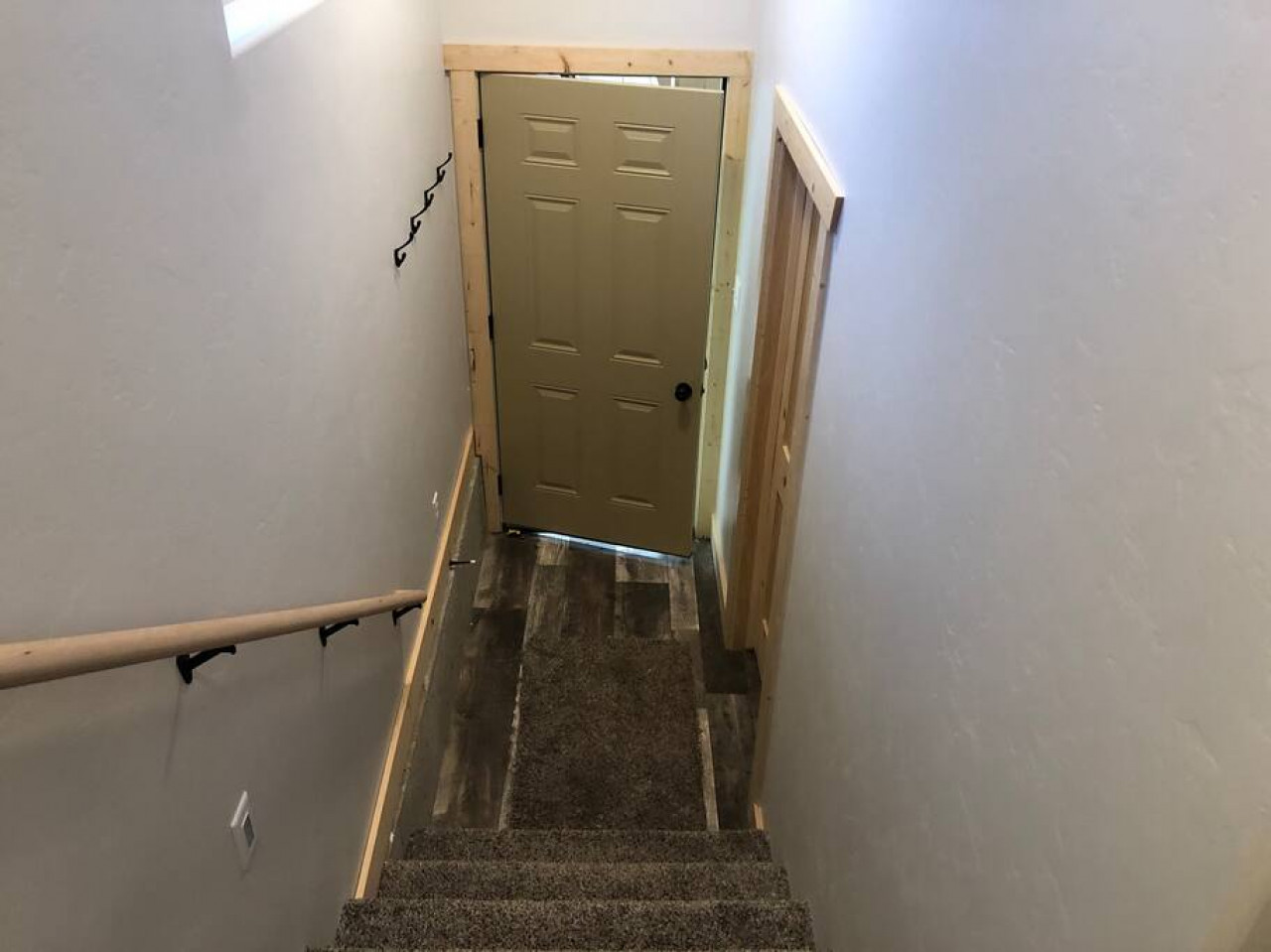 Stair way to access the kitchen/living room space and bedroom