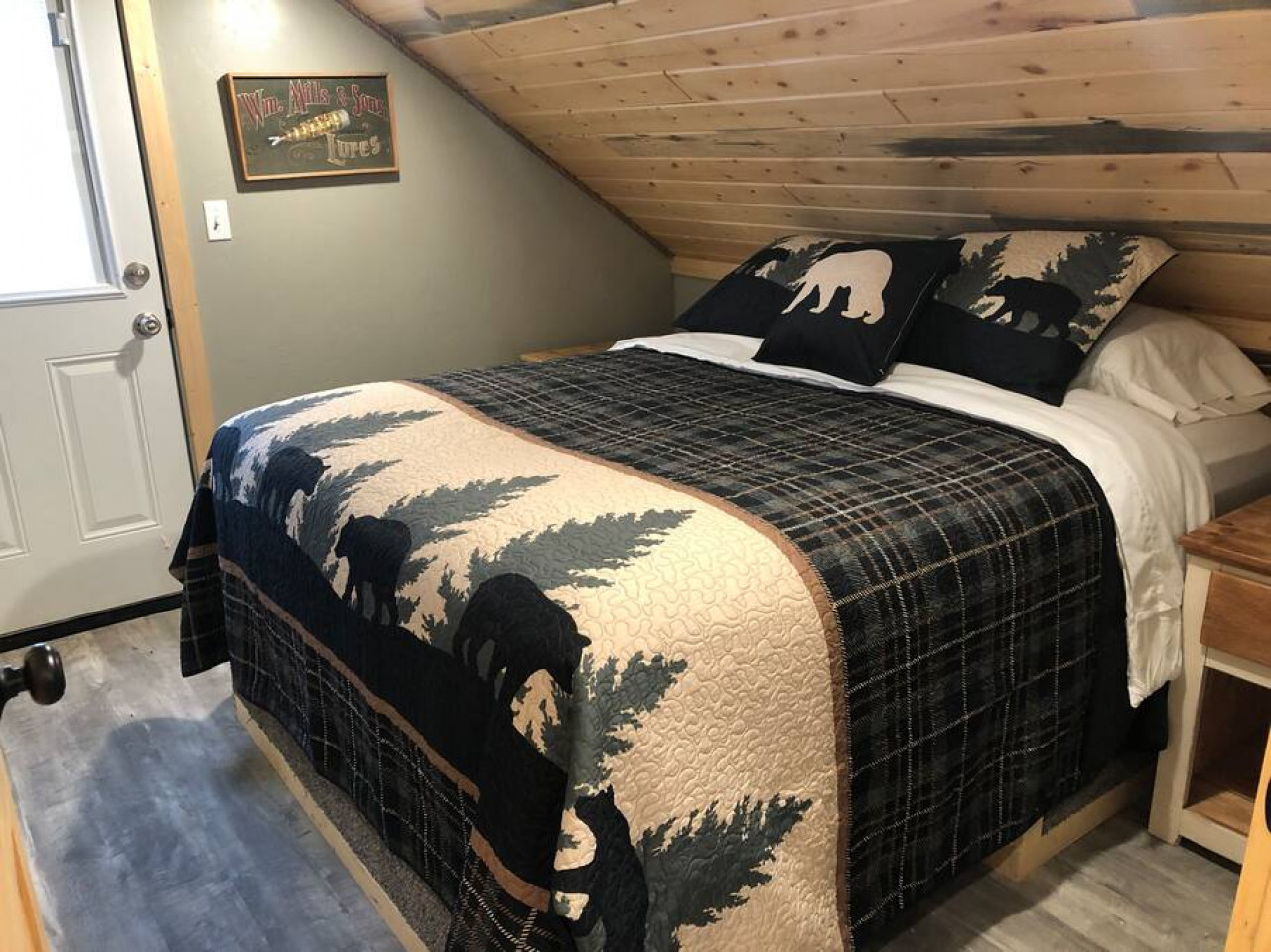 Other bedroom with a queen and a door out to a balcony as well