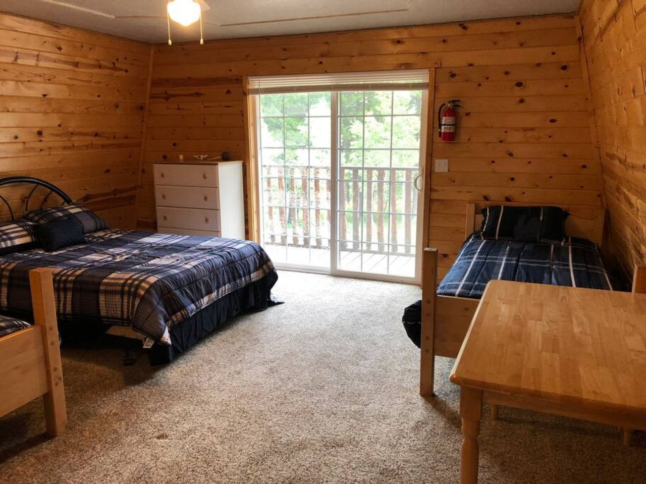 Loft sleeping area with a queen and two twins