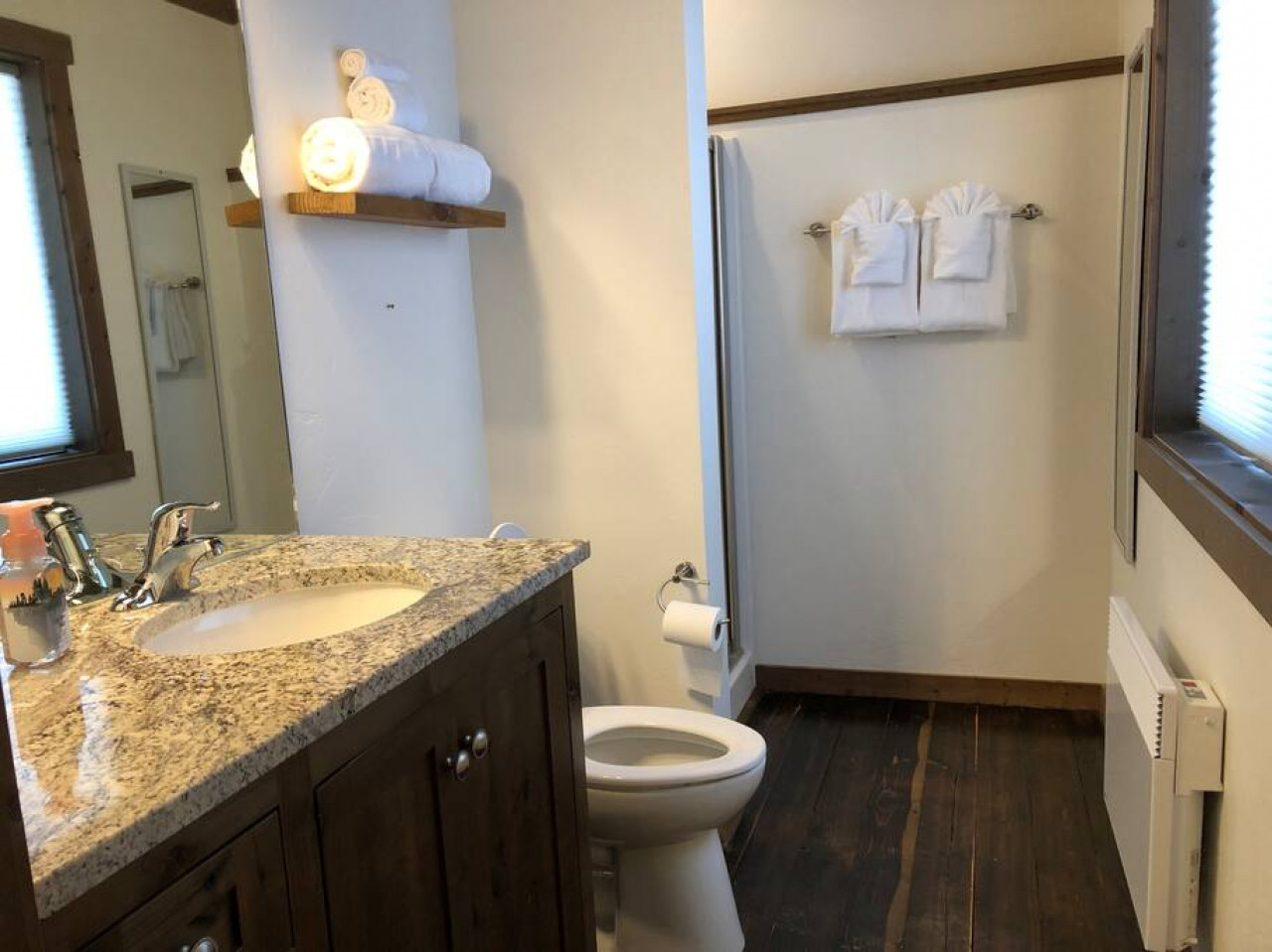 Bathroom with toilet and shower at the top of the stairs