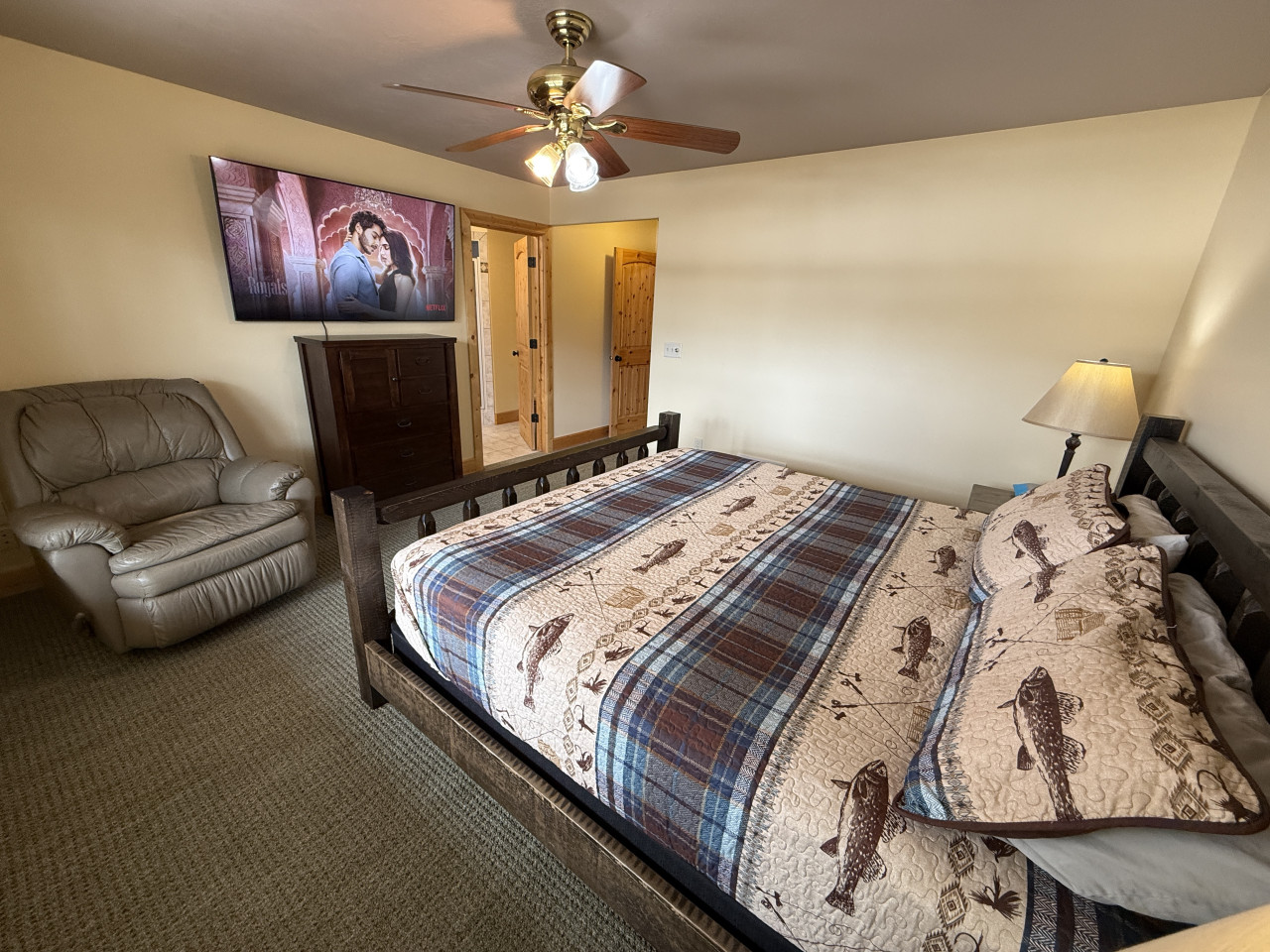 King bed and TV in the master bedroom on the main floor