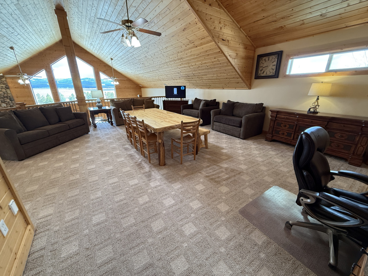 Gather round to play games on the table or relax in the upstairs living room area