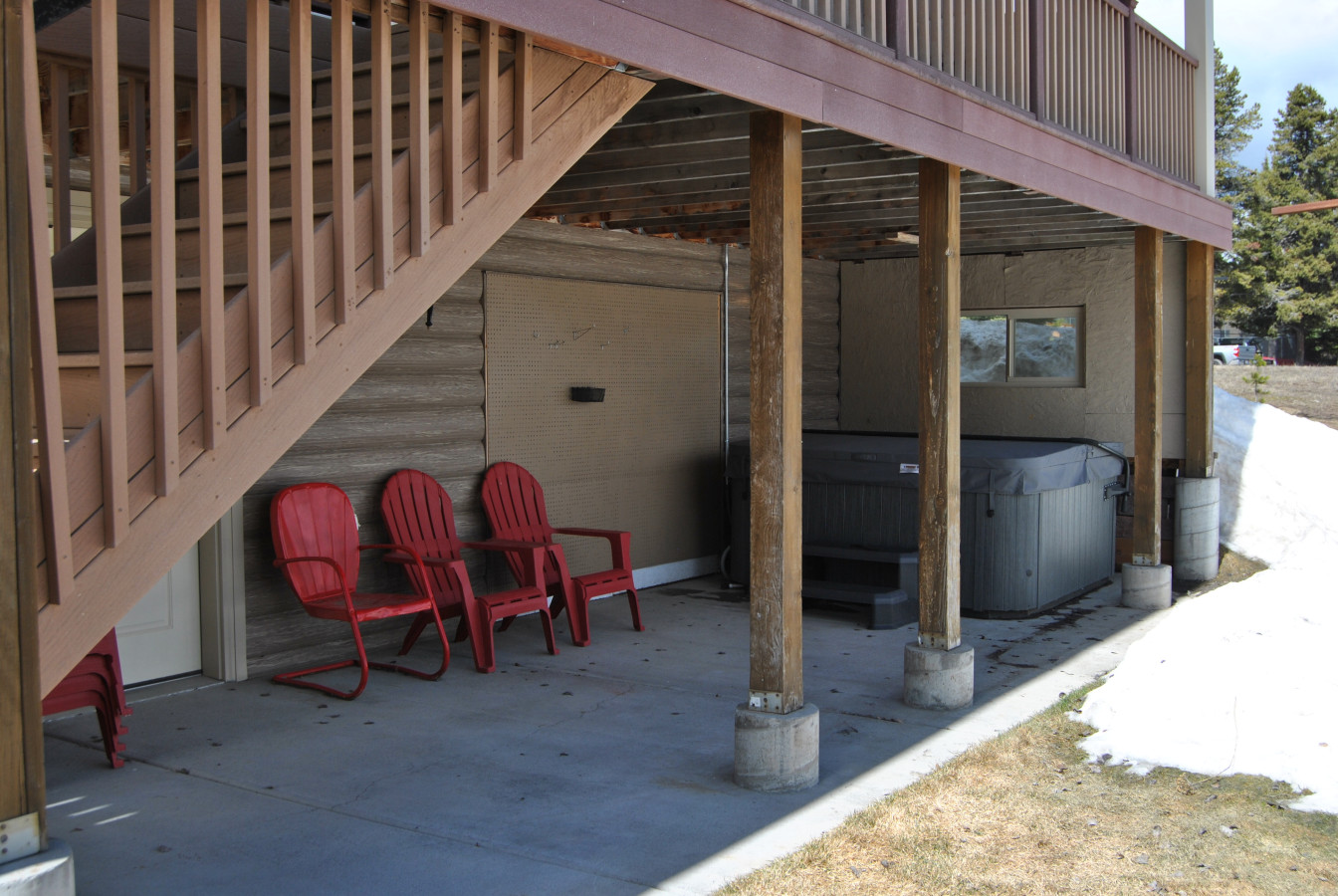 Hot tub and extra chairs on the back patio