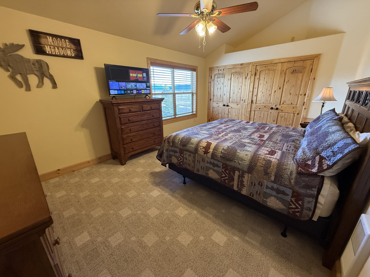 Upstairs bedroom with TV and large closet
