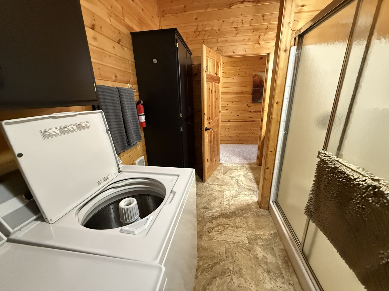 Upstairs bathroom with washer and dryer