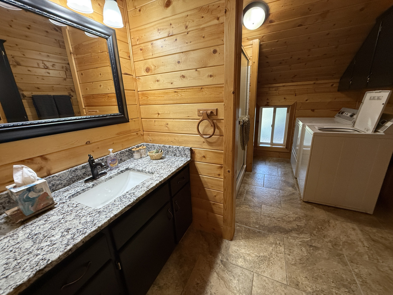 Upstairs bathroom with washer and dryer