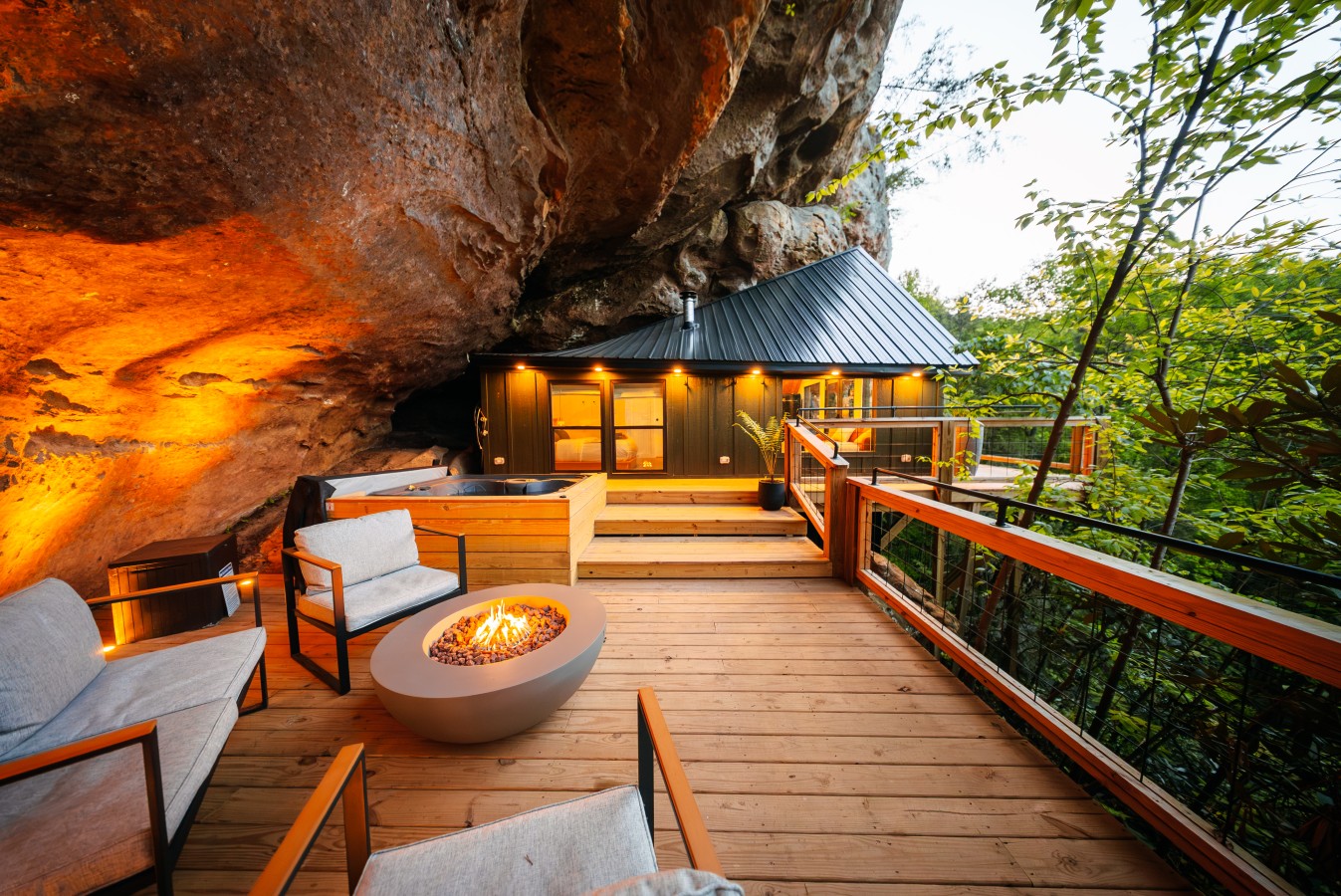 Fire pit at dusk at Rockface Retreat, a Hideaways cabin under the cliff