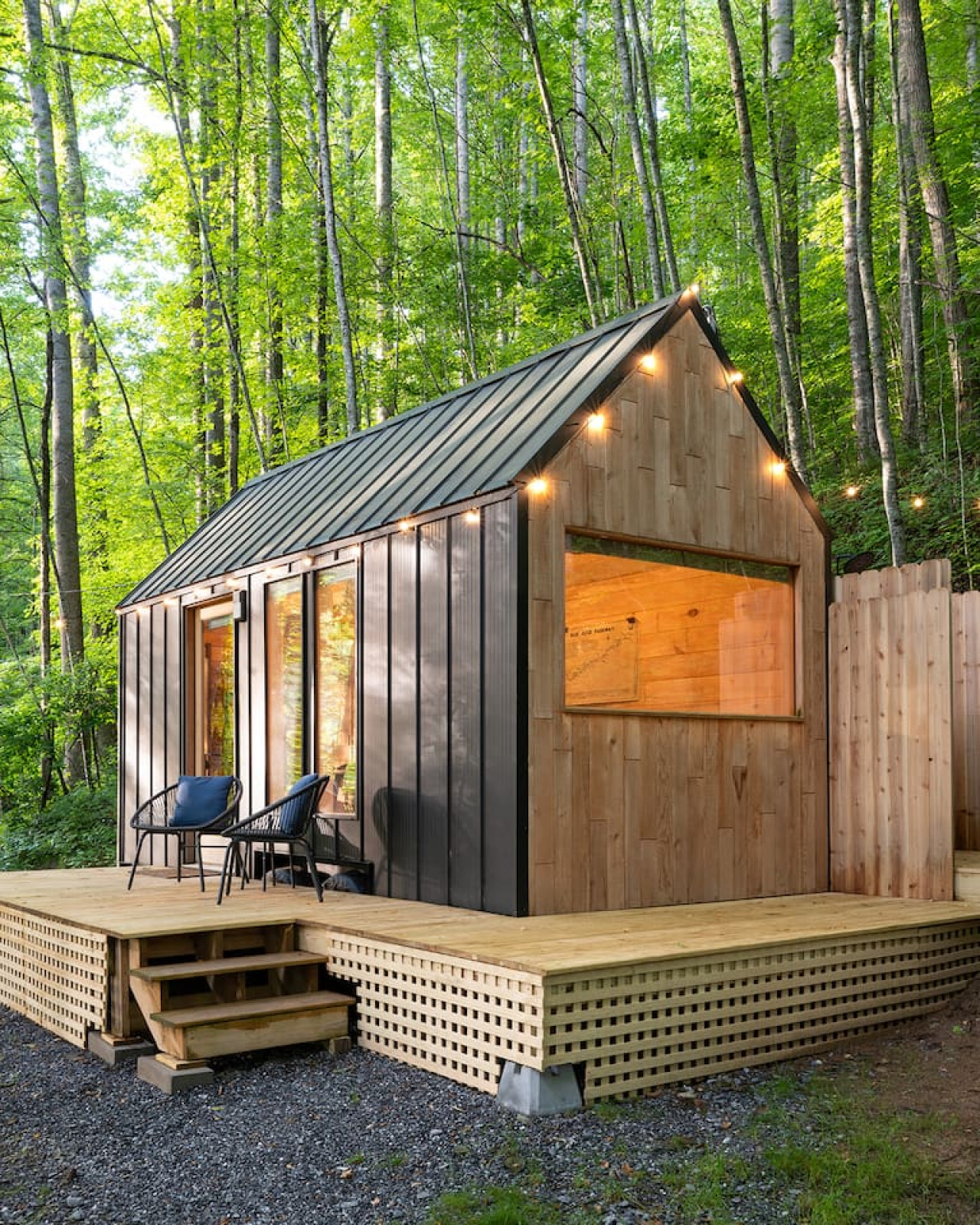 This charming little cabin in the woods is a cozy retreat where every day feels like an adventure!