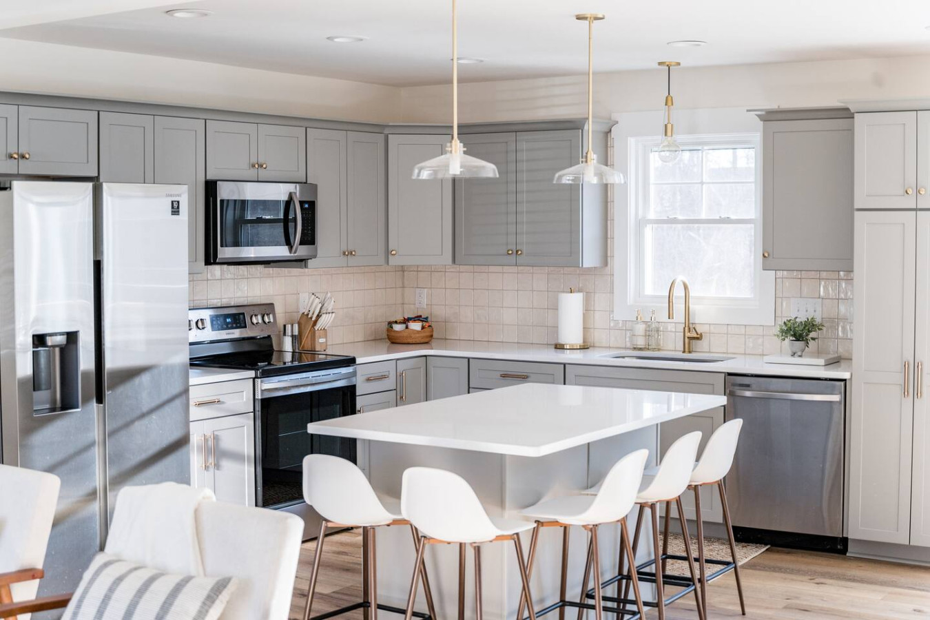 Gourmet kitchen equipped with pots, pans, dishware, and everything needed to cook meals.
