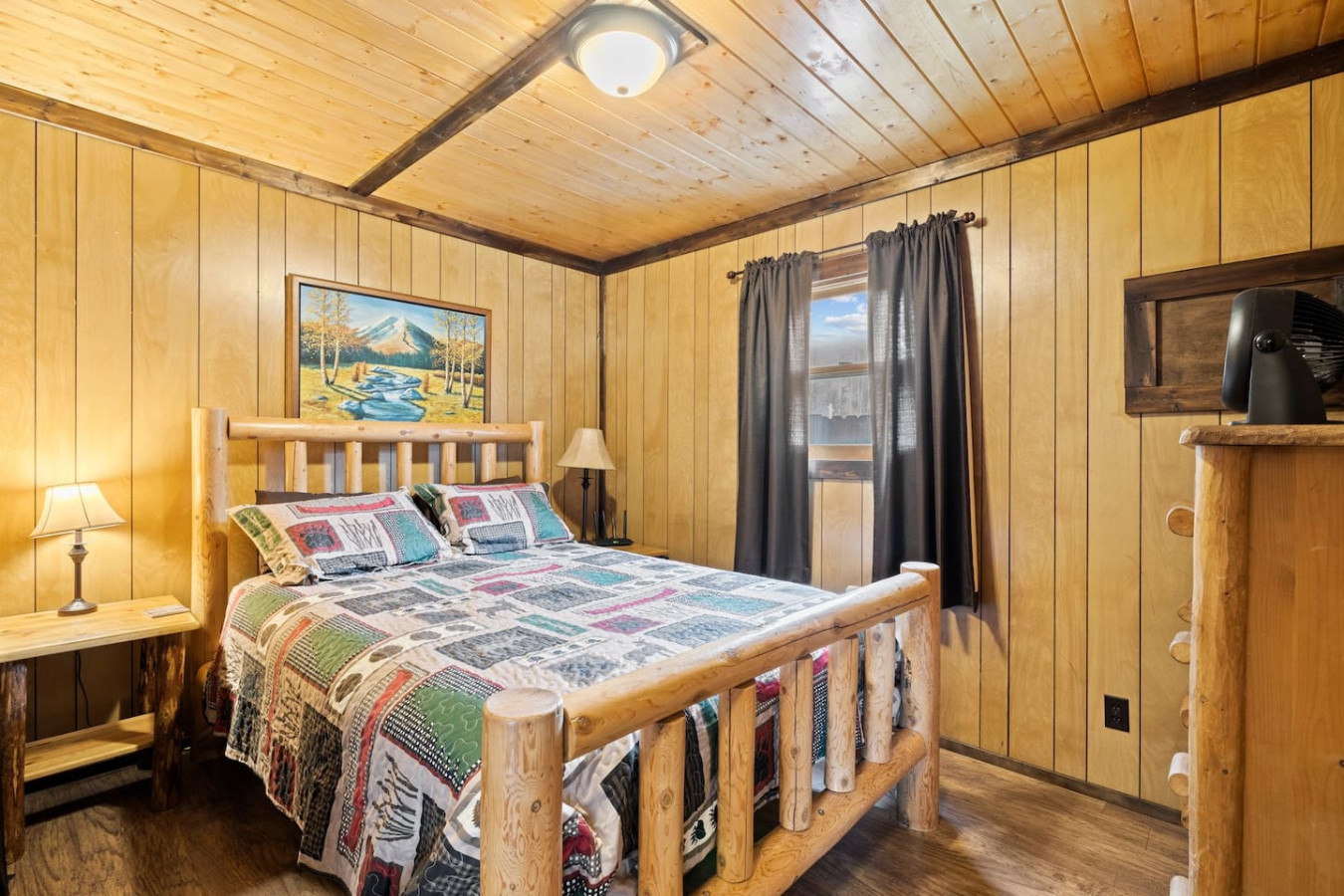 Bedroom with a cozy queen bed.