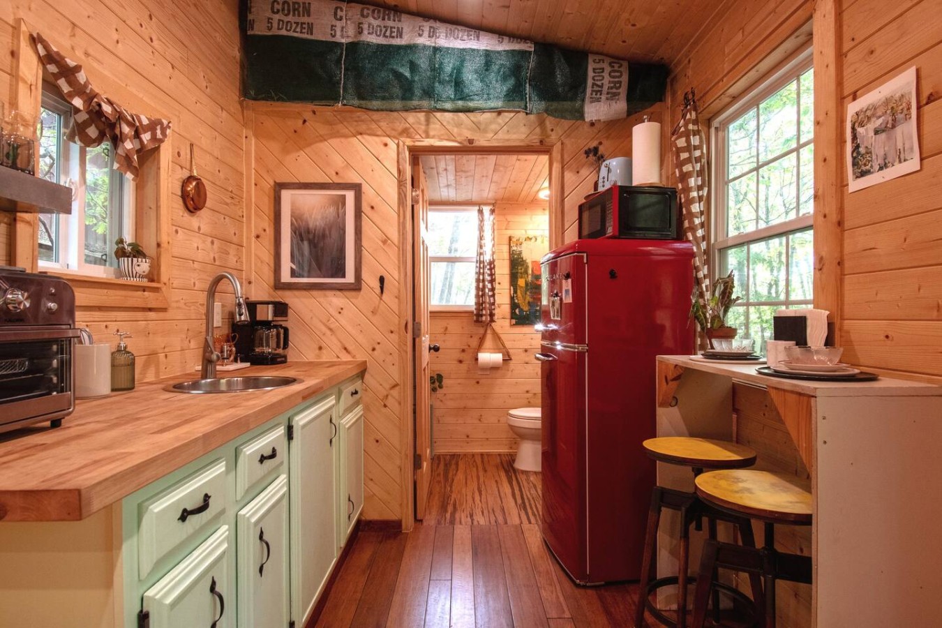 Kitchen offers an Air Fryer, induction burner, apartment-size fridge, toaster oven, microwave, and all you need for a tasty cup of coffee.